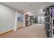 Finished basement offers a practical storage space with ample shelving and natural light at 11570 Depew Ct, Westminster, CO 80020