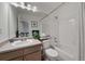 Clean bathroom with a shower-tub, vanity, and a large mirror, providing functionality at 11570 Depew Ct, Westminster, CO 80020