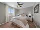 Cozy bedroom with a comfortable bed, soft lighting, and a ceiling fan, creating a relaxing atmosphere at 11570 Depew Ct, Westminster, CO 80020