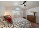 Bright bedroom featuring vaulted ceilings, natural light, and a traditional design with dresser at 11570 Depew Ct, Westminster, CO 80020