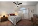 A bedroom featuring a vaulted ceiling, large window, and neutral tones at 11570 Depew Ct, Westminster, CO 80020