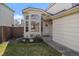Inviting front entrance with a bay window and a well-manicured lawn featuring a quaint garden and a concrete walkway at 11570 Depew Ct, Westminster, CO 80020