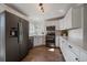 Modern kitchen with stainless steel appliances, white cabinets, and plenty of counter space for food preparation at 11570 Depew Ct, Westminster, CO 80020