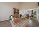 Bright living room with high ceilings, stylish furniture, and an adjacent dining area flooded with natural light at 11570 Depew Ct, Westminster, CO 80020