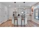 Modern kitchen with gray cabinets, granite countertops, and island at 17806 E 103Rd Ave, Commerce City, CO 80022