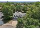 Overhead view of a beautiful home with mature trees, and lush greenery surrounding the property at 7862 W 84Th Ct, Arvada, CO 80005