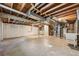 Unfinished basement showing open ceiling and walls, concrete flooring, and space for storage or customization at 7862 W 84Th Ct, Arvada, CO 80005