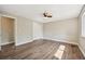 Spacious bedroom featuring wood-look floors, a ceiling fan, and a large closet at 7862 W 84Th Ct, Arvada, CO 80005