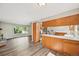 Open kitchen with breakfast bar, hardwood floors and stainless appliances at 7862 W 84Th Ct, Arvada, CO 80005
