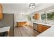 Bright kitchen with stainless steel appliances, and hardwood floors at 7862 W 84Th Ct, Arvada, CO 80005