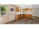 Bright kitchen with white quartz countertops, stainless appliances, a view and door leading to the backyard at 7862 W 84Th Ct, Arvada, CO 80005