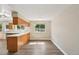 Bright eat-in kitchen featuring an open layout, large window and hardwood floors at 7862 W 84Th Ct, Arvada, CO 80005