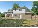 Charming two-story home featuring a brick facade with a wooden deck on the back at 7862 W 84Th Ct, Arvada, CO 80005