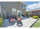 Outdoor seating area with a grill and chairs on a concrete patio at 27125 E Bayaud Ave, Aurora, CO 80018