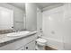 Bathroom with single vanity, granite countertops, and a bathtub shower combo at 27125 E Bayaud Ave, Aurora, CO 80018