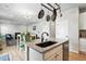 This kitchen island features granite countertops, a stainless steel dishwasher, and an undermount sink at 27125 E Bayaud Ave, Aurora, CO 80018