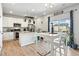 Bright kitchen with granite counters, stainless appliances, and adjacent breakfast nook at 27125 E Bayaud Ave, Aurora, CO 80018