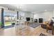 Bright living room with wood floors, sliding glass doors and contemporary decor at 27125 E Bayaud Ave, Aurora, CO 80018