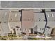 Aerial view of townhome roofs, patios and lush landscaping at 7707 S Curtice Way # D, Littleton, CO 80120