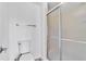 Clean and modern bathroom with frosted glass shower and toilet at 7707 S Curtice Way # D, Littleton, CO 80120