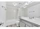 Well-lit bathroom features a shower-tub combination, toilet, and a stylish tiled vanity at 7707 S Curtice Way # D, Littleton, CO 80120