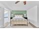 Bright bedroom with ceiling fan, neutral carpet, and unique loft access at 7707 S Curtice Way # D, Littleton, CO 80120