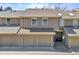 Two-car garage offers ample parking and storage in this well-maintained townhome at 7707 S Curtice Way # D, Littleton, CO 80120