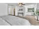 Open main bedroom with a ceiling fan, ensuite vanity, and decor that gives it a comforting feel at 7707 S Curtice Way # D, Littleton, CO 80120