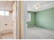 View of a bathroom and bedroom showcasing a tiled ceiling, and a window for natural light at 1045 N Pennsylvania St # 303, Denver, CO 80203