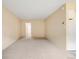 Empty bedroom with neutral carpeting, a doorway to another room, and light-colored walls at 1045 N Pennsylvania St # 303, Denver, CO 80203