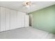 Spacious bedroom with a large closet, neutral carpet, and a ceiling fan for added comfort at 1045 N Pennsylvania St # 303, Denver, CO 80203