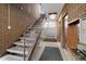 Apartment hallway with a staircase, individual mailboxes, and neutral tones at 1045 N Pennsylvania St # 303, Denver, CO 80203