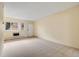 Bright, carpeted living room featuring neutral walls and natural light from a window at 1045 N Pennsylvania St # 303, Denver, CO 80203