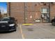 Outdoor parking lot area of building, with a couple of cars visible at 1045 N Pennsylvania St # 303, Denver, CO 80203