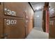 Numbered storage units inside building with concrete floors and block wall in between at 1045 N Pennsylvania St # 303, Denver, CO 80203