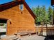 Exterior of cabin featuring a wood deck with benches and scenic views at 750 Cougar Dr, Boulder, CO 80302