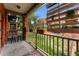 Cozy balcony features wooden accents, flower boxes and a peaceful view of the courtyard and surrounding area at 1356 N Pearl St # 109, Denver, CO 80203