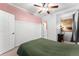 Bright bedroom with carpeted floor, a ceiling fan, and access to the closet and a doorway at 1356 N Pearl St # 109, Denver, CO 80203