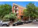 Brick apartment building with multiple balconies and well-maintained landscaping at 1356 N Pearl St # 109, Denver, CO 80203