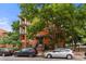 Three-story brick apartment building with trees out front at 1356 N Pearl St # 109, Denver, CO 80203