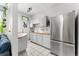 Updated kitchen featuring stainless steel appliances, light wood counters and white cabinetry at 1356 N Pearl St # 109, Denver, CO 80203