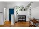 Cozy living area with hardwood floors and a view of the bar at 1356 N Pearl St # 109, Denver, CO 80203