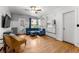 Bright living room with hardwood floors, and an adjacent kitchen at 1356 N Pearl St # 109, Denver, CO 80203