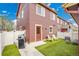Backyard featuring artificial turf, a grill, outdoor seating, and a fenced-in area for privacy at 600 Avalon Ave, Lafayette, CO 80026
