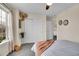 Bedroom with carpet, double closet and large windows with natural lighting at 600 Avalon Ave, Lafayette, CO 80026