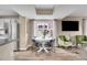 Bright dining area with contemporary table set and comfortable seating next to the living room at 600 Avalon Ave, Lafayette, CO 80026