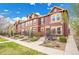 Charming townhome exterior featuring colorful siding, landscaped front yard, and welcoming entryway at 600 Avalon Ave, Lafayette, CO 80026