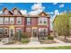 Attractive townhome with colorful siding, well-maintained landscaping, and inviting front entrance at 600 Avalon Ave, Lafayette, CO 80026