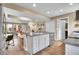 Open kitchen with an island, stainless steel dishwasher, sink and seating area at 600 Avalon Ave, Lafayette, CO 80026