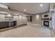 Finished basement with a wet bar, wine rack, cozy fireplace, and plush carpeting at 3937 Osceola St, Denver, CO 80212